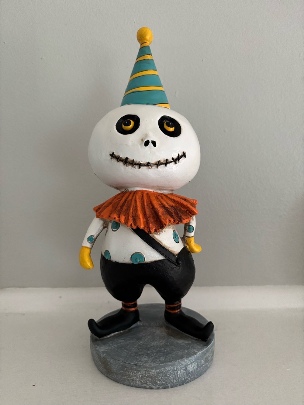 Whimsical White Skeleton Clown Figurine with Orange Collar Halloween